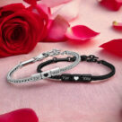 Firefly features a pair of sleek, matching silver or metallic bracelets placed on a soft, light pink (1) (2)